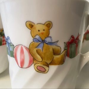 Four Teddy bear milk glass mugs by Corningware